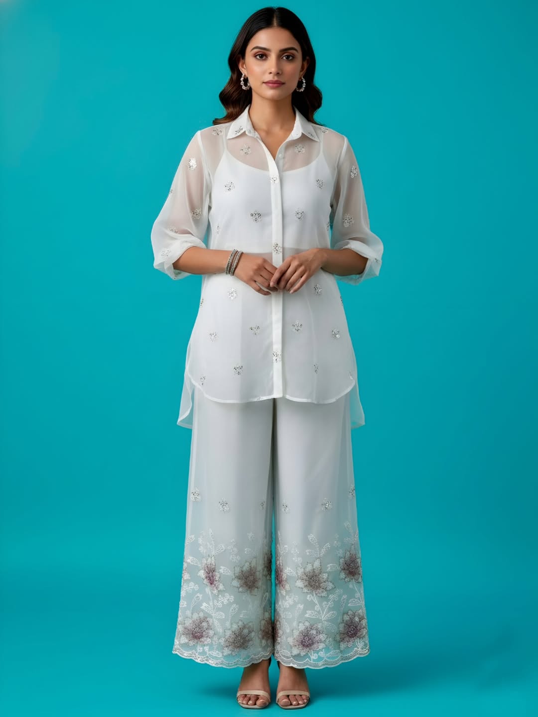 delicate georgette, adorned with hand embroidered borders.perfectly crafted for ethnic elegance